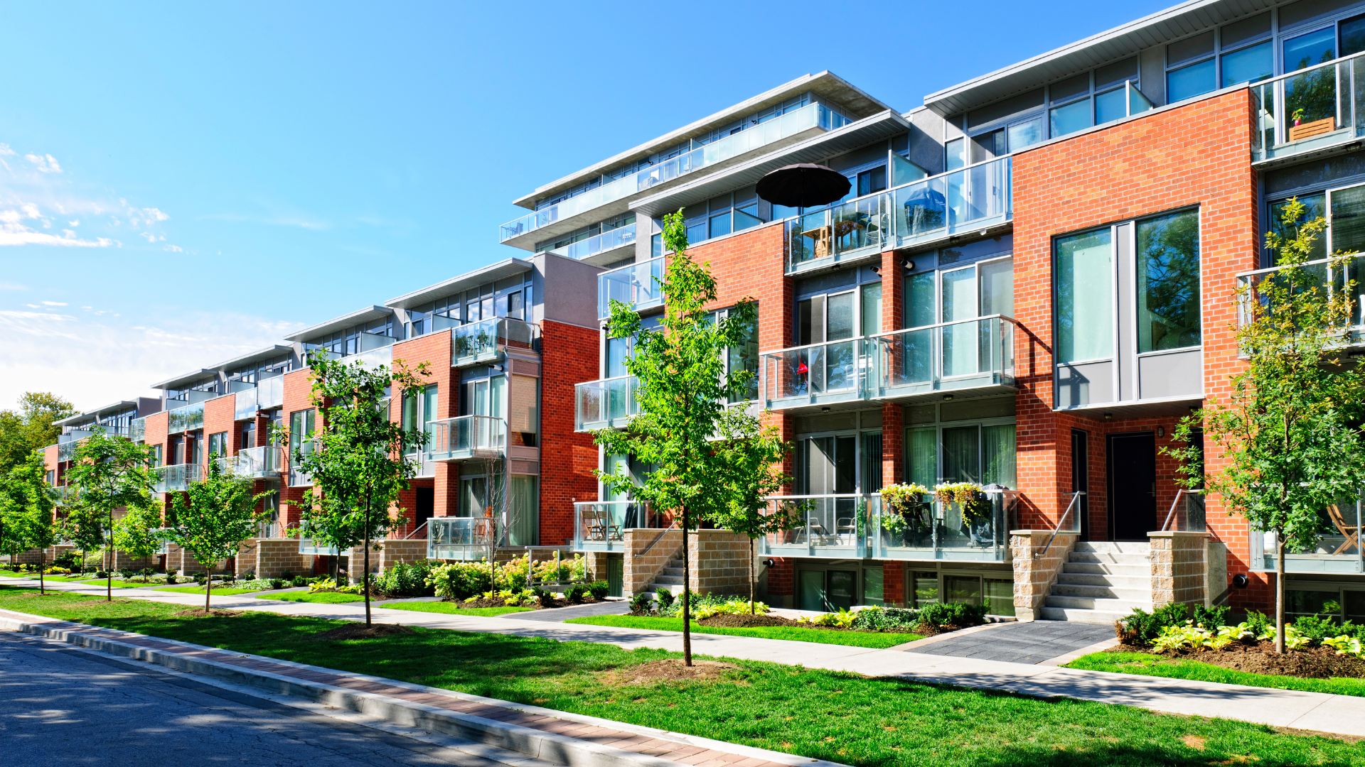 Apartment buildings with green trees infront